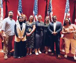 7 People standing together.